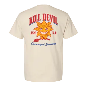 A cream-colored short-sleeve t-shirt showing the back graphic print. The design features a large orange cartoon sun with a face, the words 'KILL DEVIL' in red arched above it, 'ASM' and 'N.